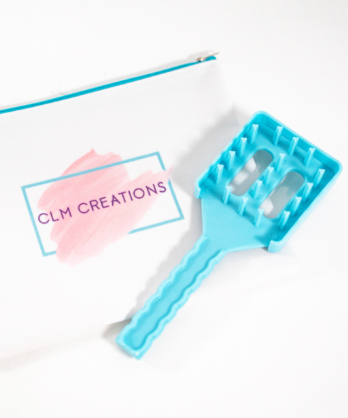 a CLM Creations brush bag and the CLM Volumizer next to it